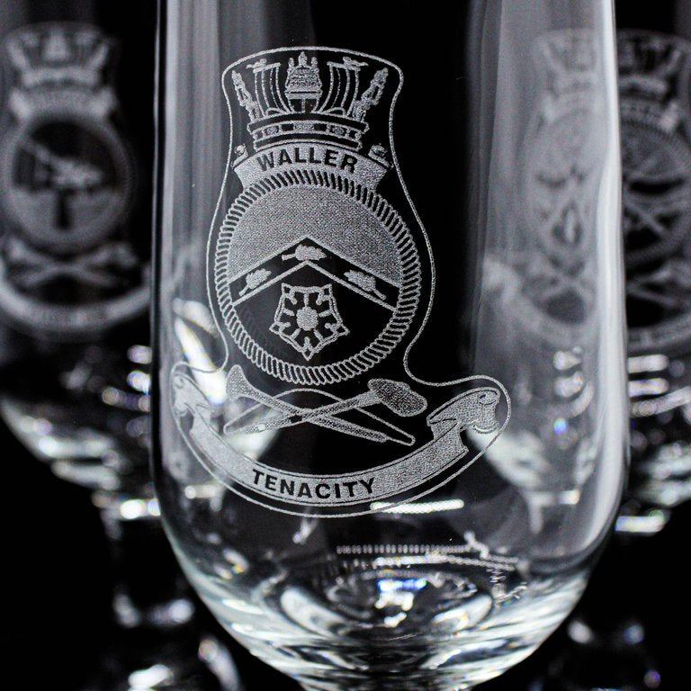 Laser engraved logo on a curved glass surface for personalised gift glasses