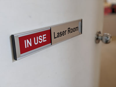 Custom door names with sliding plaque for IN USE rooms
