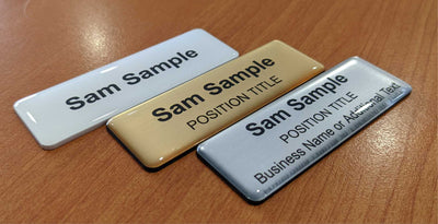 Premium finish on 75x25 name badges, crystal acrylic domed resin