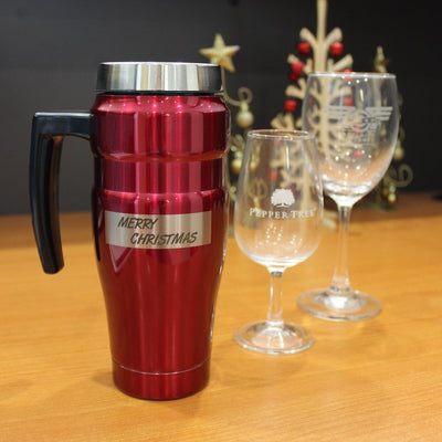 Travel mug with laser engraved text on curved surface, engraved wine glasses with company logos for christmas gifts