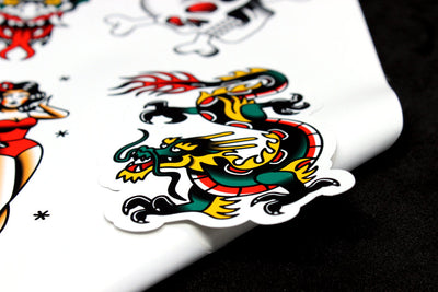 Colourful tatoo art dragon sticker with contoured cut out on peel-off backing