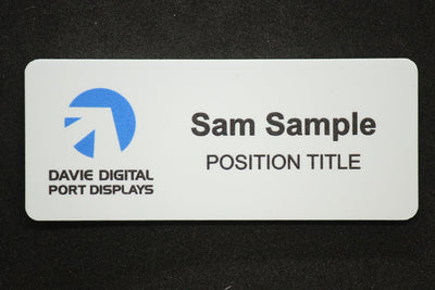 WHite plastic name badge in large size 85x35mm with colour print and name in bold, ample space for company and position title