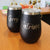 Laser engraved travel tumblers for corporate christmas gifts. Gold text on texured black metal