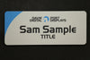 Large sparkle silver plastic name badge 80x30mm rectangle with company logo and name in blue and black print