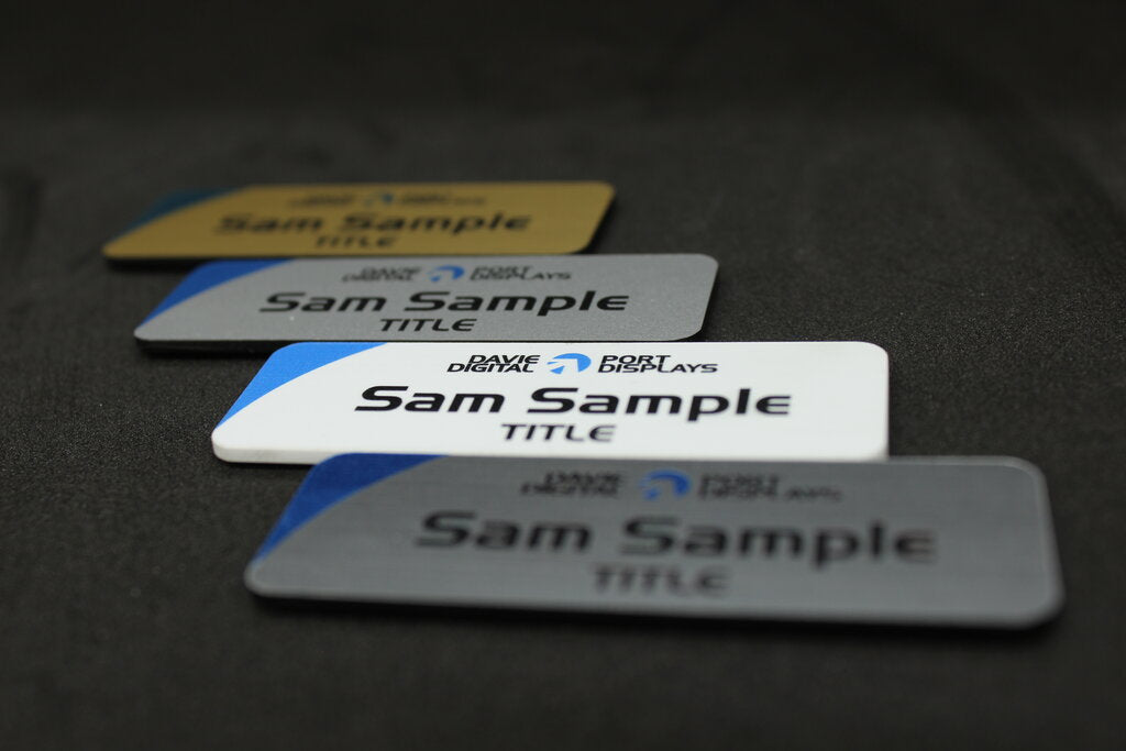 Small name badges in gold white or silver, custom designs with your name, title and logo